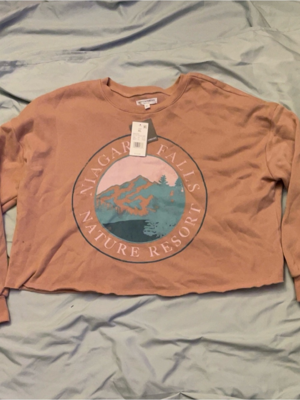 Grayson Threads Peach Cropped Nature Resort Sweatshirt with Teal Graphic